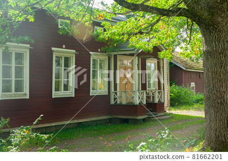 KOUVOLA, FINLAND - SEPTEMBER 20, 2018: Beautiful red old wooden house on the territory of Anjala manor. KOUVOLA, FINLAND - SEPTEMBER 20, 2018: Beautiful red old wooden house on the territory of Anjala manor. 81662201