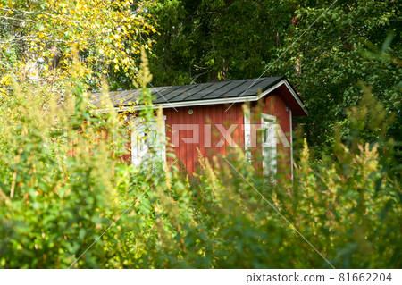 KOUVOLA, FINLAND - SEPTEMBER 20, 2018: Beautiful red old wooden house on the territory of Anjala manor. KOUVOLA, FINLAND - SEPTEMBER 20, 2018: Beautiful red old wooden house on the territory of Anjala manor. 81662204