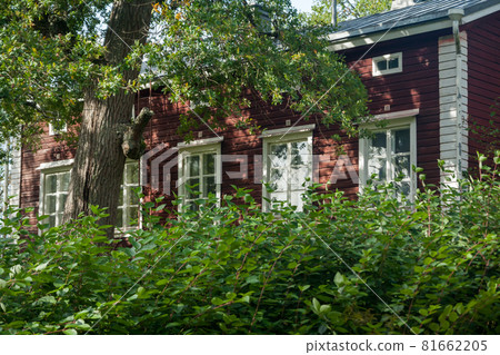 KOUVOLA, FINLAND - SEPTEMBER 20, 2018: Beautiful red old wooden house on the territory of Anjala manor. KOUVOLA, FINLAND - SEPTEMBER 20, 2018: Beautiful red old wooden house on the territory of Anjala manor. 81662205
