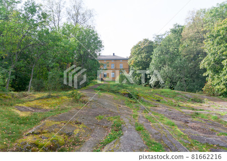 KOUVOLA, FINLAND - SEPTEMBER 20, 2018: Beautiful yellow old building of abandoned Anjala manor. The building was built at the turn of the 19th century and belonged to the Wrede family from 1837 KOUVOLA, FINLAND - SEPTEMBER 20, 2018: Beautiful yellow old building of abandoned Anjala manor. The building was built at the turn of the 19th century and belonged to the Wrede family from 1837 81662216