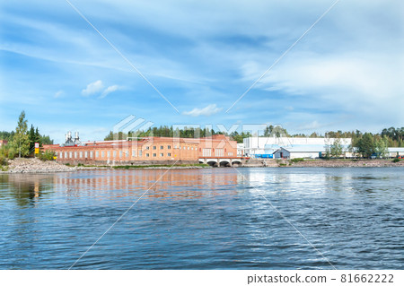 KOUVOLA, FINLAND - SEPTEMBER 20, 2018: Hydroelectric power generation plant and Ankkapurha Industrial Museum at Kymijoki river, Finland KOUVOLA, FINLAND - SEPTEMBER 20, 2018: Hydroelectric power generation plant and Ankkapurha Industrial Museum at Kymijoki river, Finland 81662222