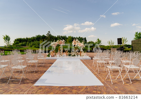 the wedding ceremony in the open air of fresh flowers, with candles the wedding ceremony in the open air of fresh flowers, with candles 81663214