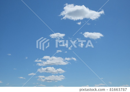 Small cumulus clouds against the blue sky. Background. Small cumulus clouds against the blue sky. Background. 81663787