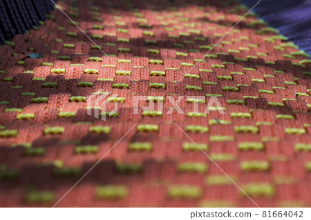 Braided colorful ropes, Soft and flexible rope. Beautiful cotton rope woven together in orderly manner and shallow depth of field. Braided colorful ropes, Soft and flexible rope. Beautiful cotton rope woven together in orderly manner and shallow depth of field. 81664042