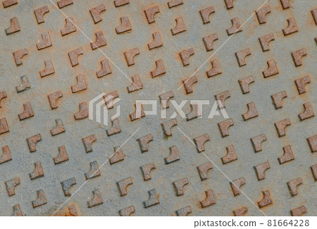 Close-up of the pattern old rusty manhole cap. Grunge manhole cover, View from above. 81664228