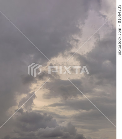 The sun shines through the clouds in the sky. The shape of the clouds evokes imagination and creativity. The sun shines through the clouds in the sky. The shape of the clouds evokes imagination and creativity. 81664235