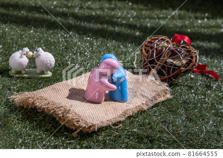 Sheep ceramic couple dolls Kissing and ceramic couple dolls hug on lawn. Love concept. 81664555