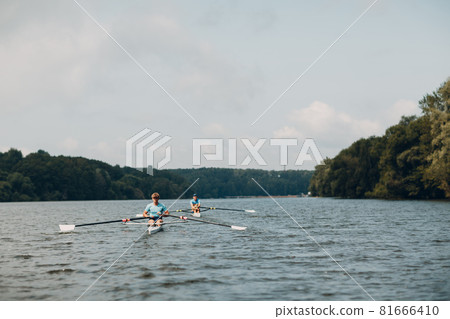 Sportsman single scull man rower rowing on boat 81666410