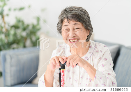 Senior woman wand worried sofa Senior woman wand worried sofa 81666923