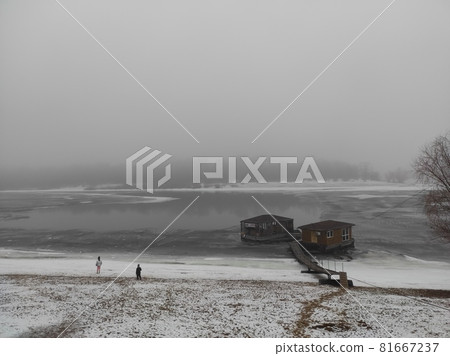 two houses on the frozen river and two children two houses on the frozen river and two children 81667237