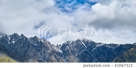 Georgian snowy mountains in the clouds 81667323