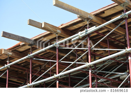 KEDAH, MALAYSIA -AUGUST 05, 2016: Scaffolding used as the temporary structure to support platform, form work and structure at the construction site. Also used it as a walking platform for workers.  81669618