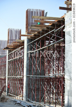 KEDAH, MALAYSIA -AUGUST 05, 2016: Scaffolding used as the temporary structure to support platform, form work and structure at the construction site. Also used it as a walking platform for workers.  81669619