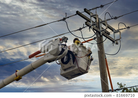 Engineering check working on high-voltage tower on after tornado 81669710