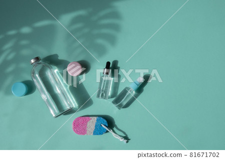 Body and spa treatments. Natural beauty products. Eco cream, serum, empty bottle for skin care. Glass pipette. Pumice stone for feet. Top view. Body and spa treatments. Natural beauty products. Eco cream, serum, empty bottle for skin care. Glass pipette. Pumice stone for feet. Top view. 81671702