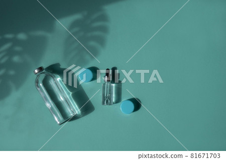 Mock up of a glass bottle and dropper bottle. Body and spa treatments. Natural beauty products. Eco cream, serum, empty bottle for skin care. Eyedropper for oily cosmetics. 81671703