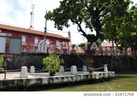 MELAKA, MALAYSIA -NOVEMBER 12, 2012: The scenery along the way at Melaka waterfront while riding the Melaka River Cruise. The river is the main trade route during the golden age of the Malacca Sultana MELAKA, MALAYSIA -NOVEMBER 12, 2012: The scenery along the way at Melaka waterfront while riding the Melaka River Cruise. The river is the main trade route during the golden age of the Malacca Sultana 81671708