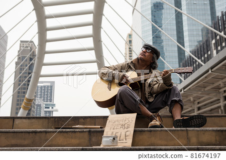 Old beggar sing and play flolk song guitar for money Old beggar sing and play flolk song guitar for money 81674197