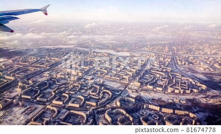 Moscow cityscape covered in snow overlooking from an airplane Moscow cityscape covered in snow overlooking from an airplane 81674778
