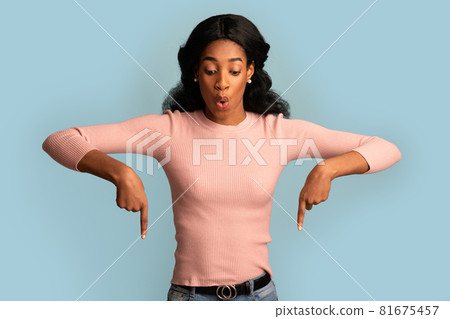 Look There. Excited Black Woman Pointing Down With Two Fingers 81675457