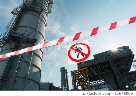 A sign prohibiting the passage of outsiders on a poster with a red and white ribbon. 81676069