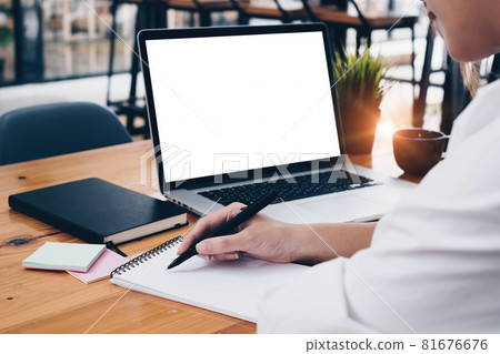 Close-up of a businesswoman using a laptop computer to audit the company's budget. Tax information is calculated by accountants. Close-up of a businesswoman using a laptop computer to audit the company's budget. Tax information is calculated by accountants. 81676676