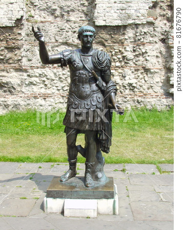 Statue of Roman Emperor Trajan in front of Roman walls in London, Uk. Statue of Roman Emperor Trajan in front of Roman walls in London, Uk. 81676790