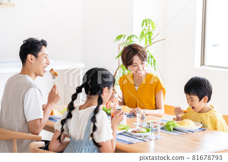 Family of four eating in the dining room Family of four eating in the dining room 81678793