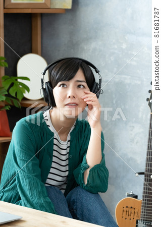 A woman listening to music A woman listening to music 81681787