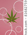 Green hemp leaves on pink background. 3d render texture. Round glass background with glowing circles. 81682759