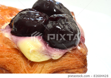 Sweets and cherry danish pastry with custard cream and cherries on top of the pie Sweets and cherry danish pastry with custard cream and cherries on top of the pie 81684428