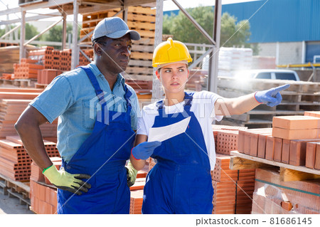 Man and woman in outdoor construction material storage Man and woman in outdoor construction material storage 81686145