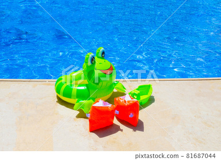 Colorful inflatable ball near swimming pool 81687044