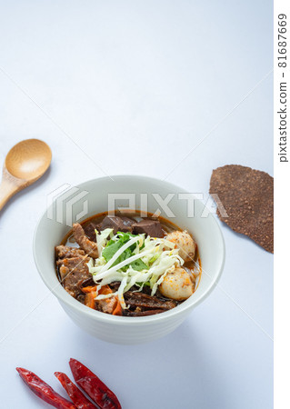 noodles with spicy pork sauce Nam ngiao on white background.Khanom Jin Nam Ngiao with copy space. 81687669