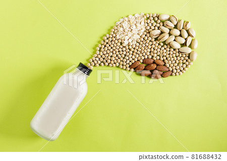 Various plant based milk on green background 81688432