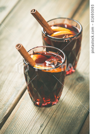 Mulled wine with spices and orange slices Mulled wine with spices and orange slices 81693093