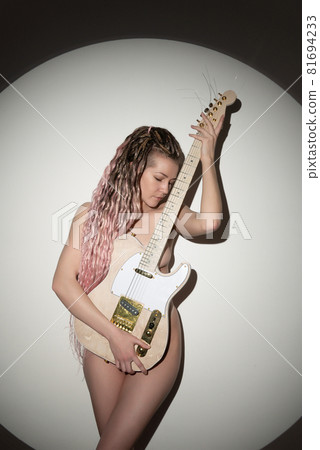 Beautiful young sexy woman with guitar. Musical girl 81694233