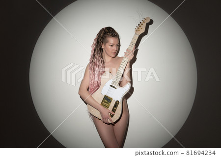 Beautiful young sexy woman with guitar. Musical girl 81694234