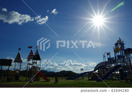 Park scenery with summer blue sky, sun, white clouds and playset Park scenery with summer blue sky, sun, white clouds and playset 81694280
