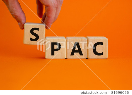 SPAC, special purpose acquisition company symbol. Wooden cubes with word 'SPAC' on beautiful orange background, copy space. Business and SPAC, special purpose acquisition company concept. 81696036