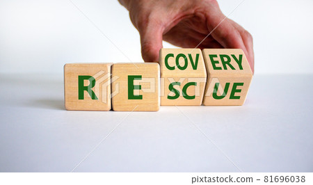 Recovery and rescue symbol. Businessman turns cubes and changes the word 'recovery' to 'rescue'. Beautiful white background. Business and recovery - rescue concept. Copy space. 81696038