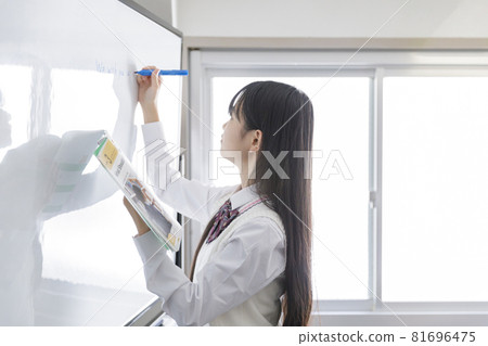 High school girl using a whiteboard 81696475