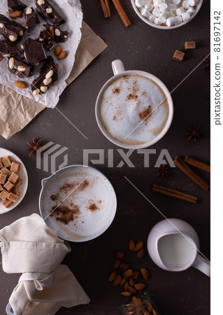 Winter cocoa drink with milk foam in a mug Winter cocoa drink with milk foam in a mug 81697142