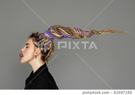 caucasian young woman with long hair afro dreadlocks 81697189