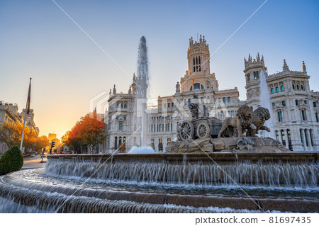 Madrid Spain, sunrise city skyline at Cibeles Fountain and Palace with autumn foliage season Madrid Spain, sunrise city skyline at Cibeles Fountain and Palace with autumn foliage season 81697435