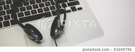 Laptop computer and headphone on desk, e-learning online, webinar for education and learning. Laptop computer and headphone on desk, e-learning online, webinar for education and learning. 81699786