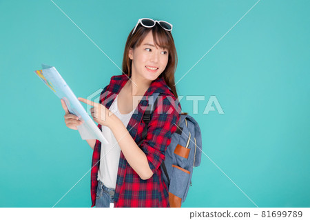 Beautiful happy young asian woman travel looking and pointing a paper map isolated. Beautiful happy young asian woman travel looking and pointing a paper map isolated. 81699789