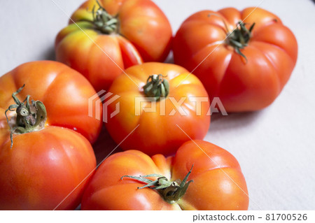 Group of uncooked raw red tomatoes Group of uncooked raw red tomatoes 81700526