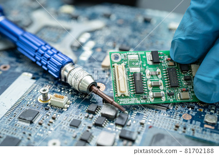 Repairing inside of hard disk by soldering iron. Integrated Circuit. the concept of data, hardware, technician and technology. 81702188