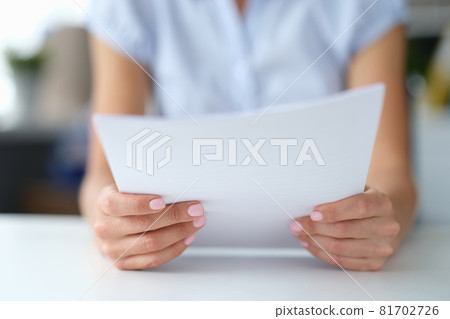 Woman reading notice of mortgage payments closeup 81702726